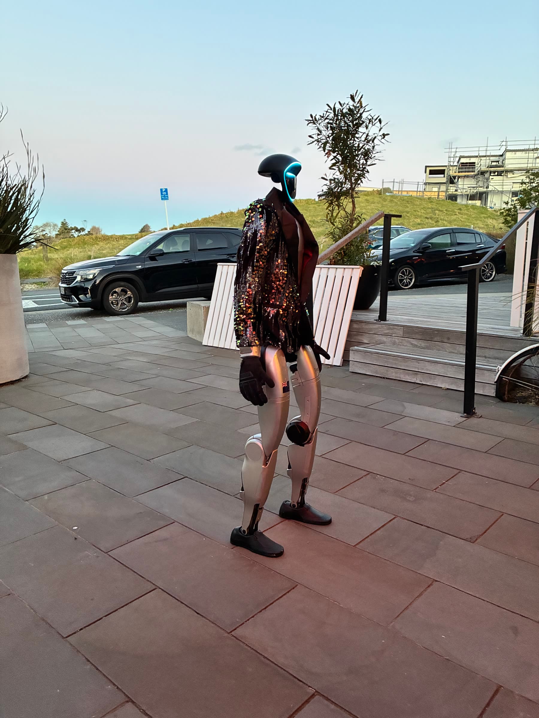 Sequin-jacket greeter welcoming guests